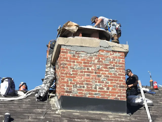 Huntington Beach Chimney Sweep installing a custom chimney crown in Huntington Beach, CA